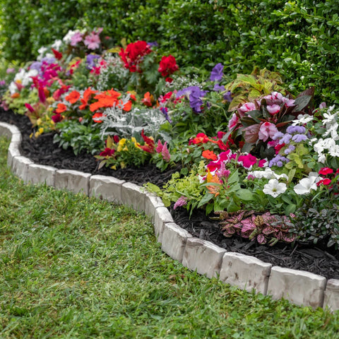 EasyFlex edging atop landscape fabric reduces weed growth where borders meet.