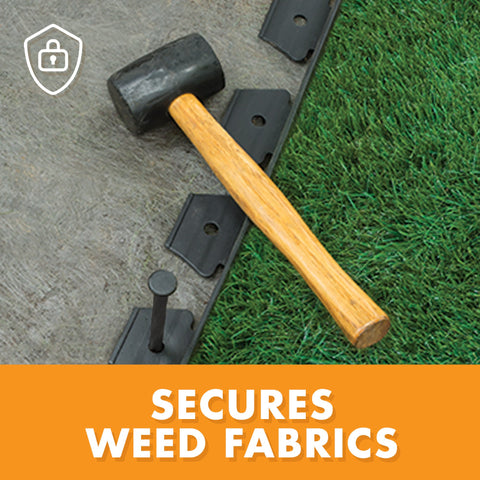 Hammering EasyFlex spikes into no-dig edging with a mallet for quick installation.