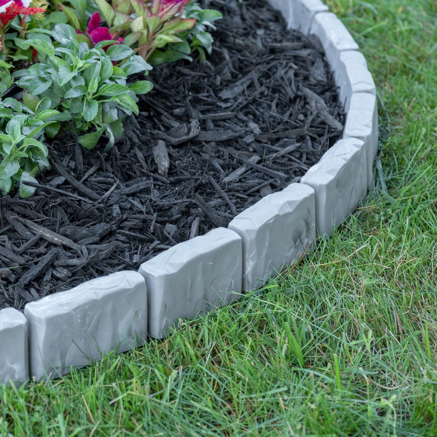 EasyFlex edging installed on landscape fabric to prevent weeds