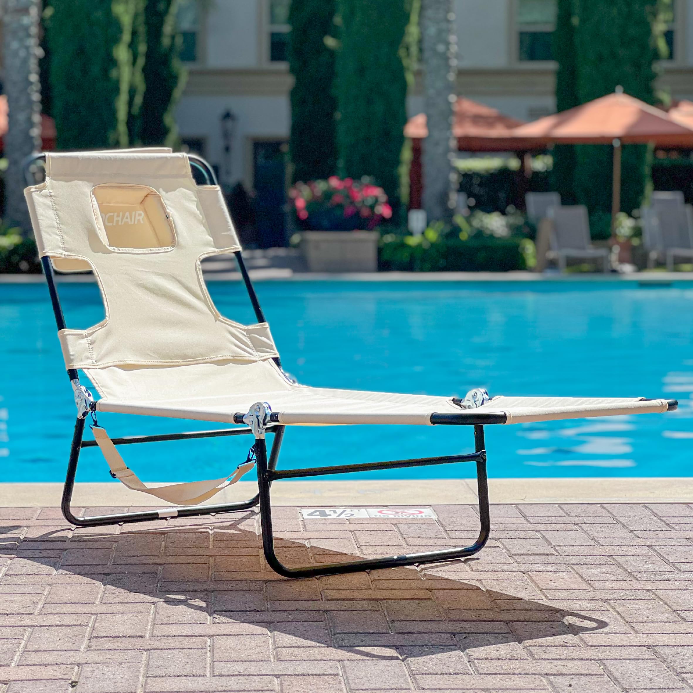 EasyGo Products chair shows arm holes for relaxed tanning posture.