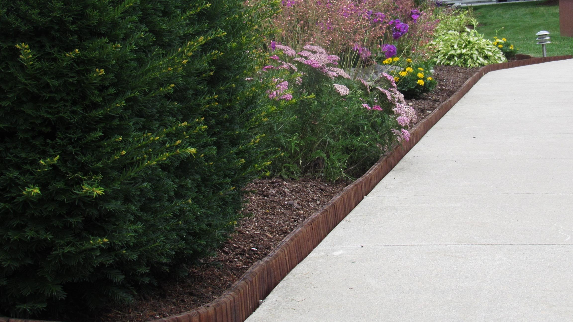 Eco-Green border segment is 4 inches high for defining garden beds.