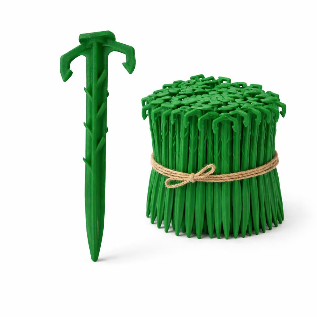 Ecoduty biodegradable 4inch stake securing landscape fabric in soil.