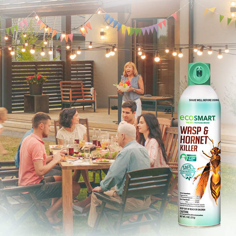 EcoSmart plant-based formula spray beside fresh herbs, offering chemical-free protection.