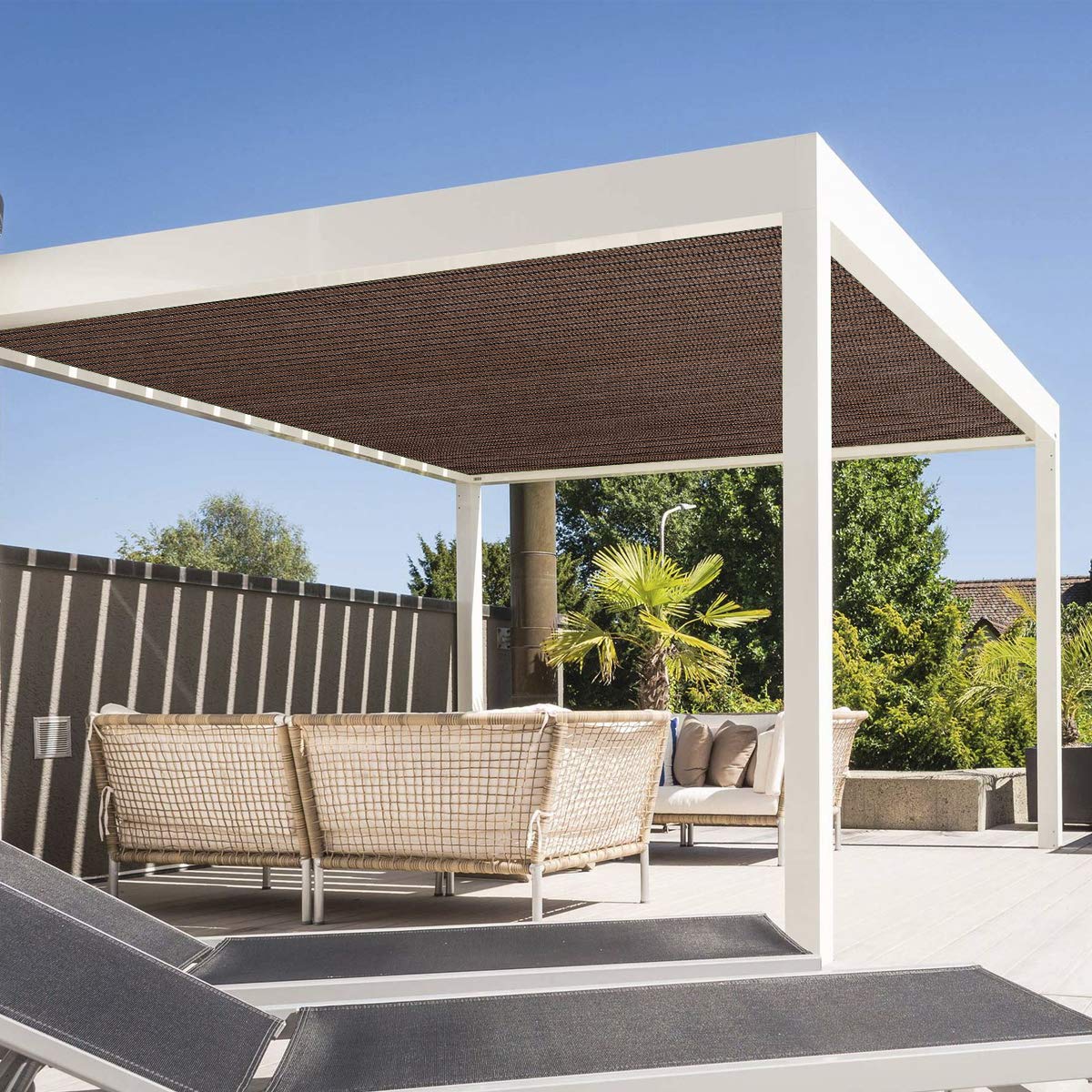 Eden's Decor shade sail protecting garden and plants from sun.