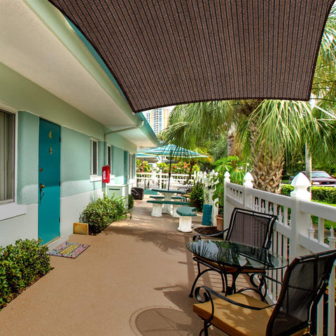 Eden's Decor shade sail over patio area providing cooling shade.