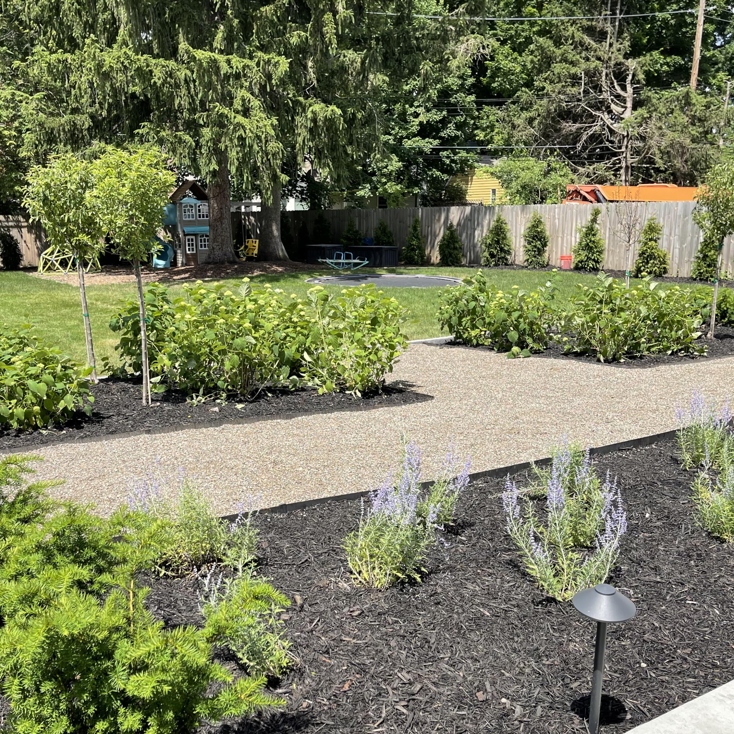 Edge Right rust patina evolution shown on curved edging for curb appeal.