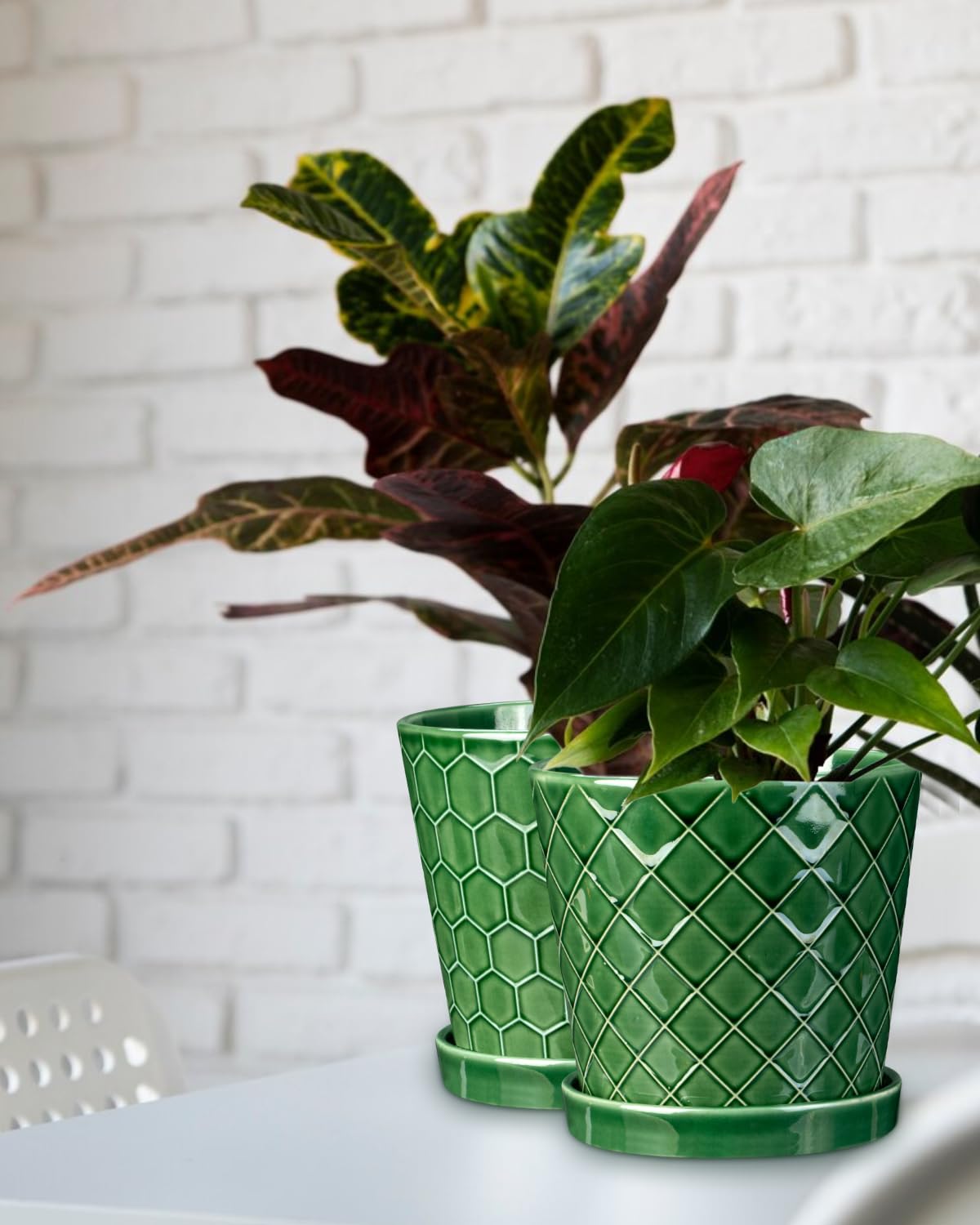 EFISPSS patina-finish plant pot adds contemporary flair to any workspace.