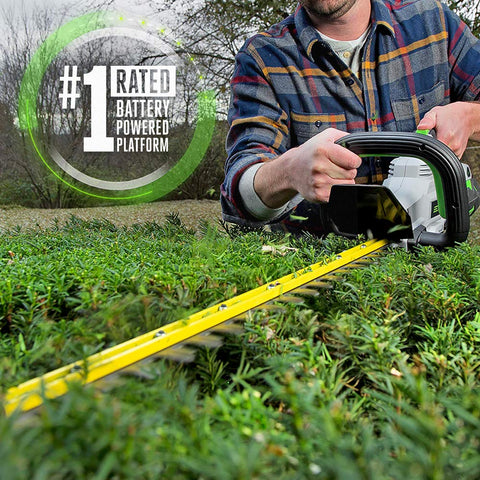 HT2411 battery and charger powering cordless hedge work on the go.