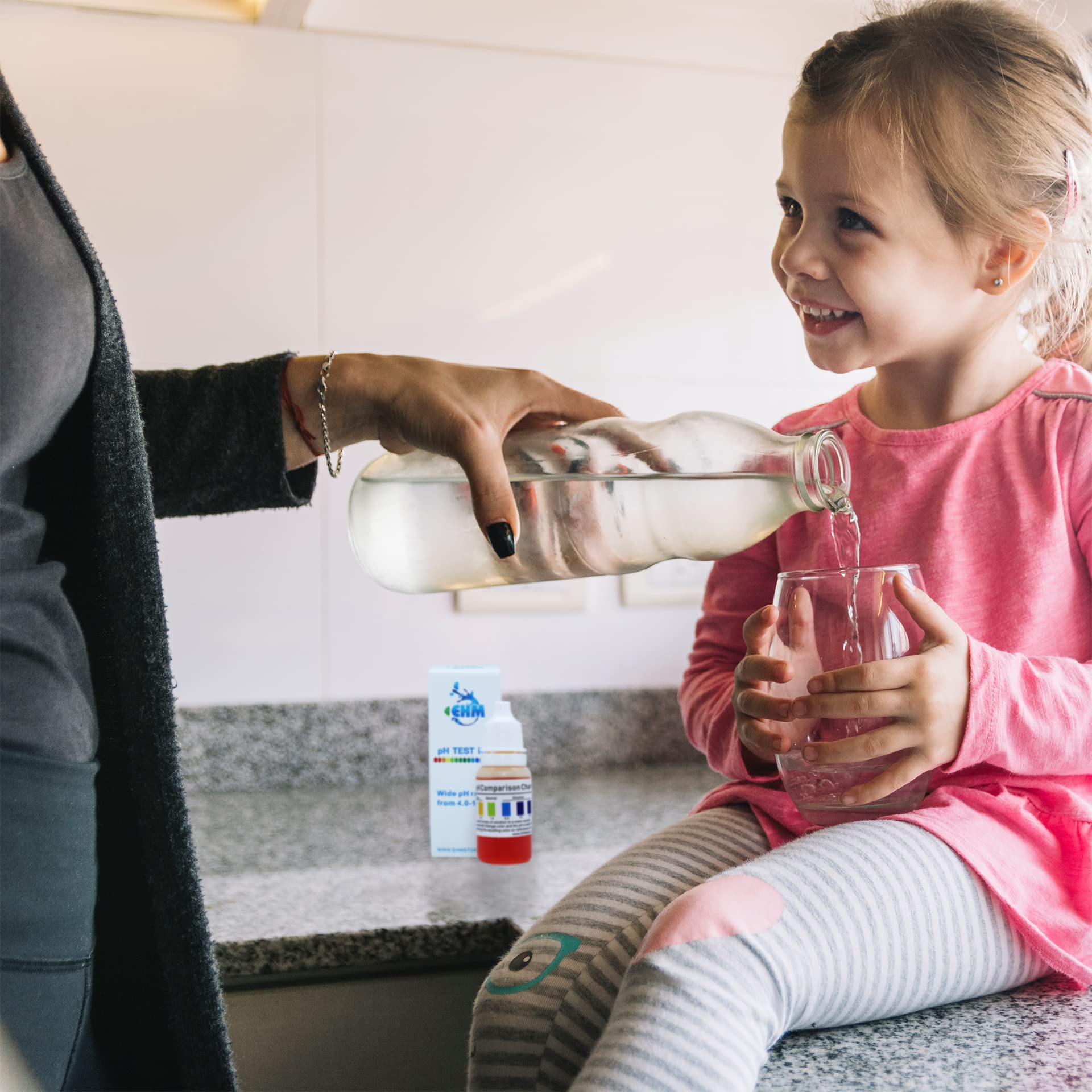 EHM Alkaline Water pH test kit ready-to-use on kitchen counter.