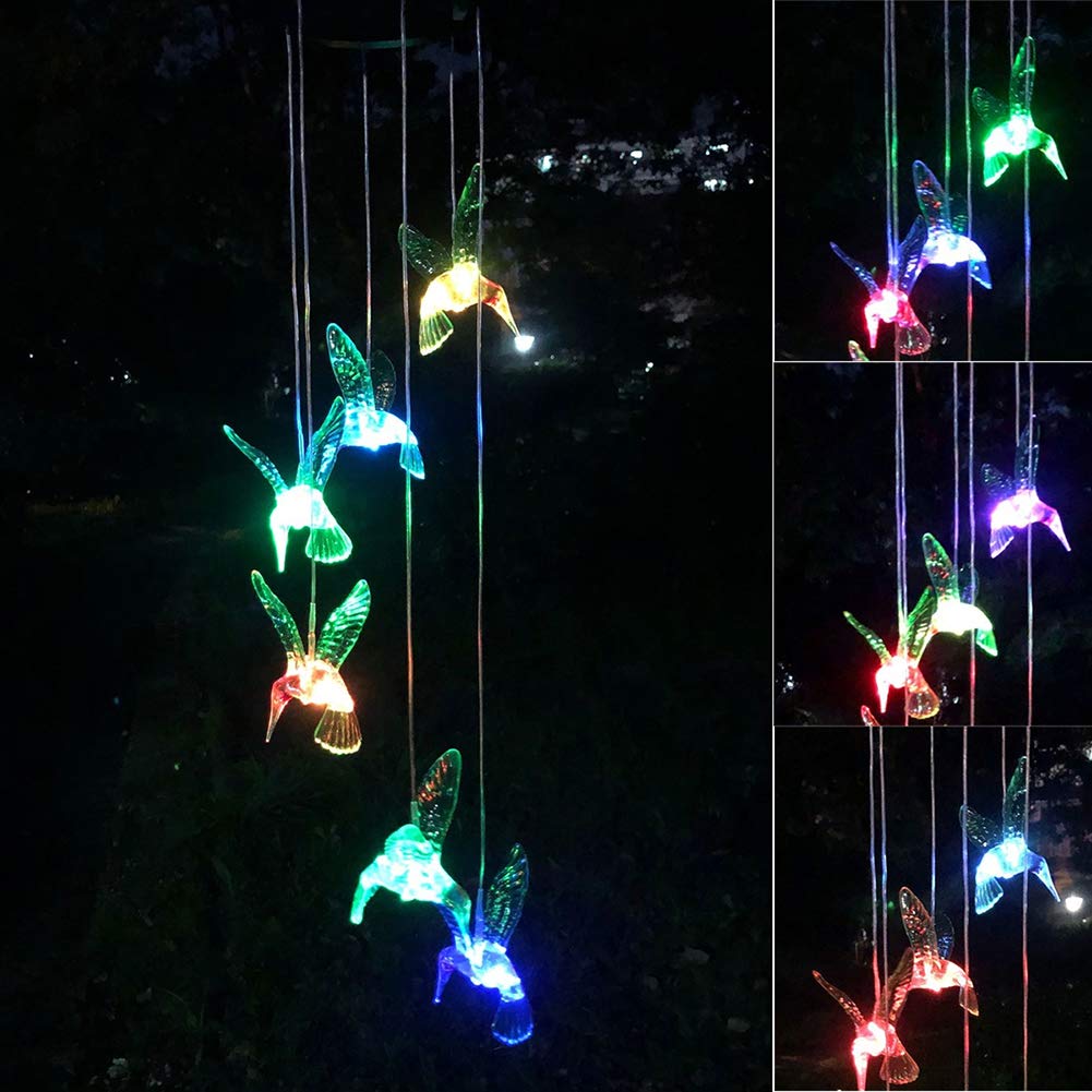 Garden decor from Eleven Direction featuring hummingbird chimes in a yard setting.
