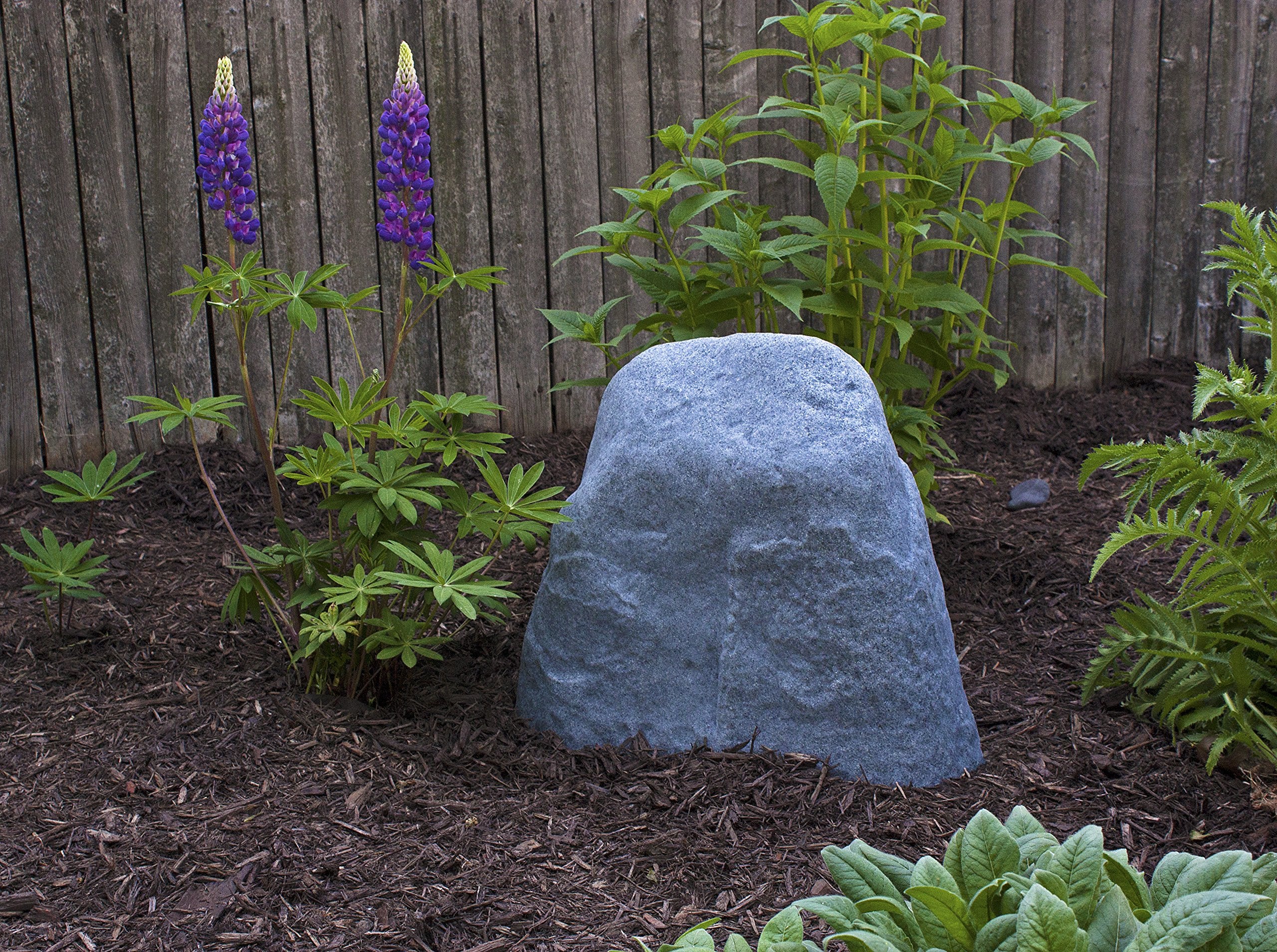 Emsco Group 2186 landscape rock anchored-stake installation keeps rocks upright against wind