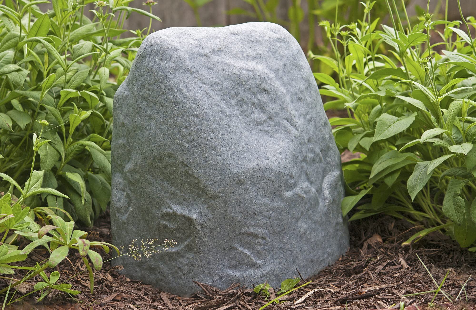 Emsco 2187 landscape rock shown in a yard setup for quick anchoring.