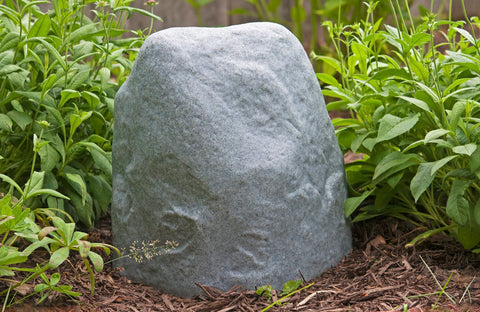 Emsco 2187 landscape rock shown in a yard setup for quick anchoring.