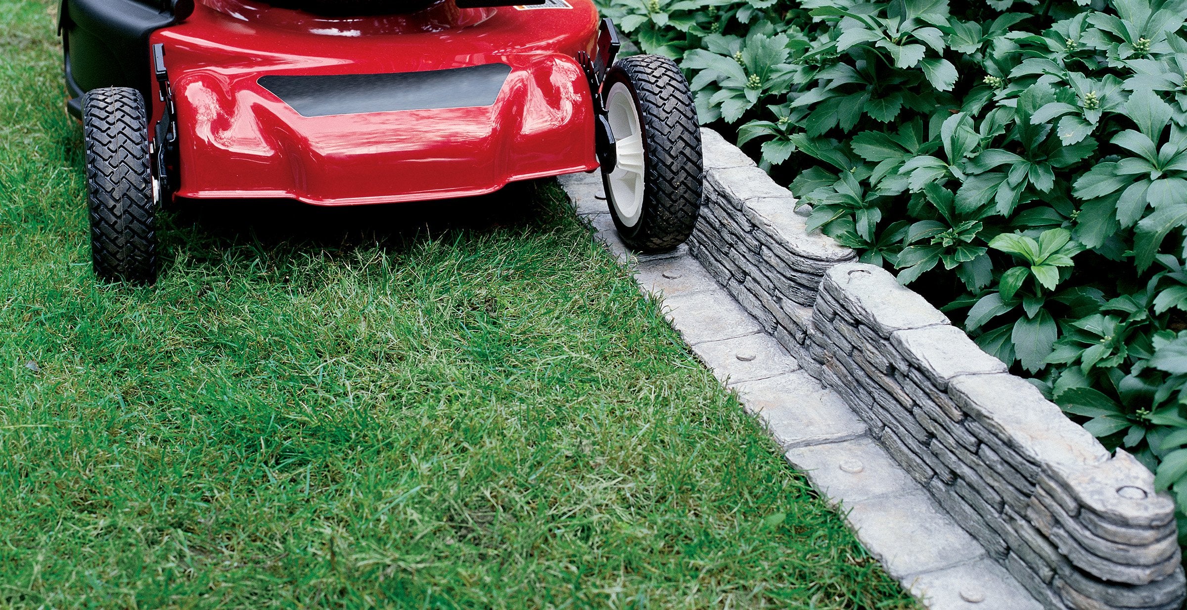 Emsco Bedrocks trim-free flange highlights grass-free edging for neat edges