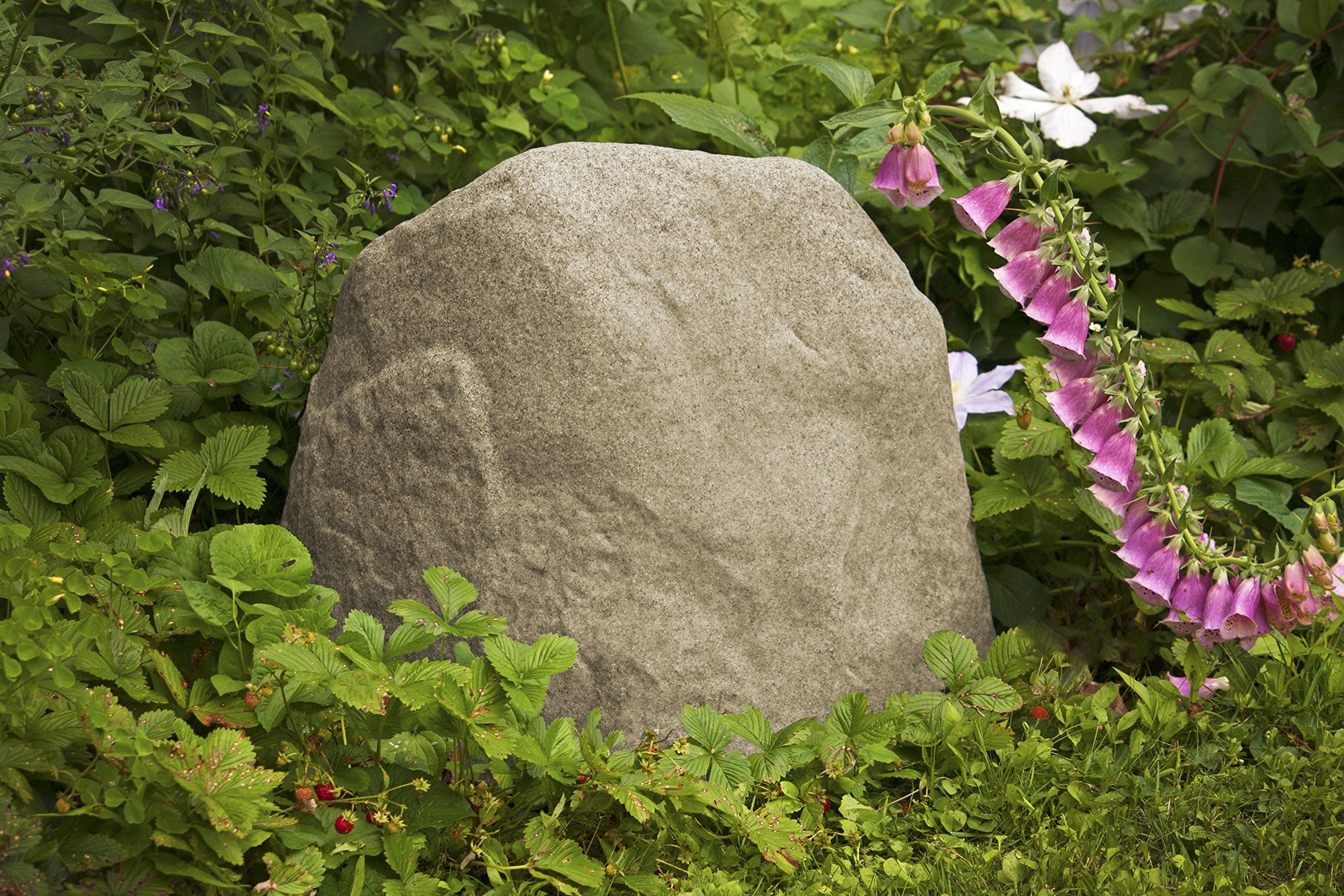 Emsco Group 2180 stakes shown securing rocks against wind