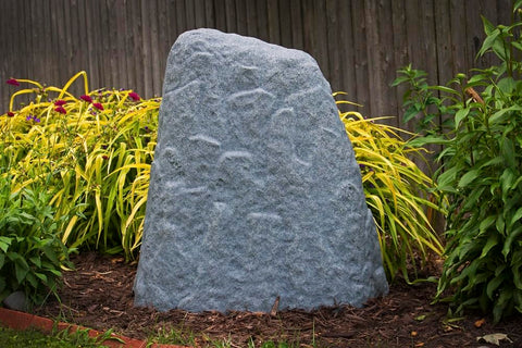 Emsco Group 2282 well cover using rock to hide utilities.