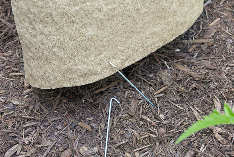 EMSCO Group Landscape Rock hides wells and utilities for a cleaner landscape.