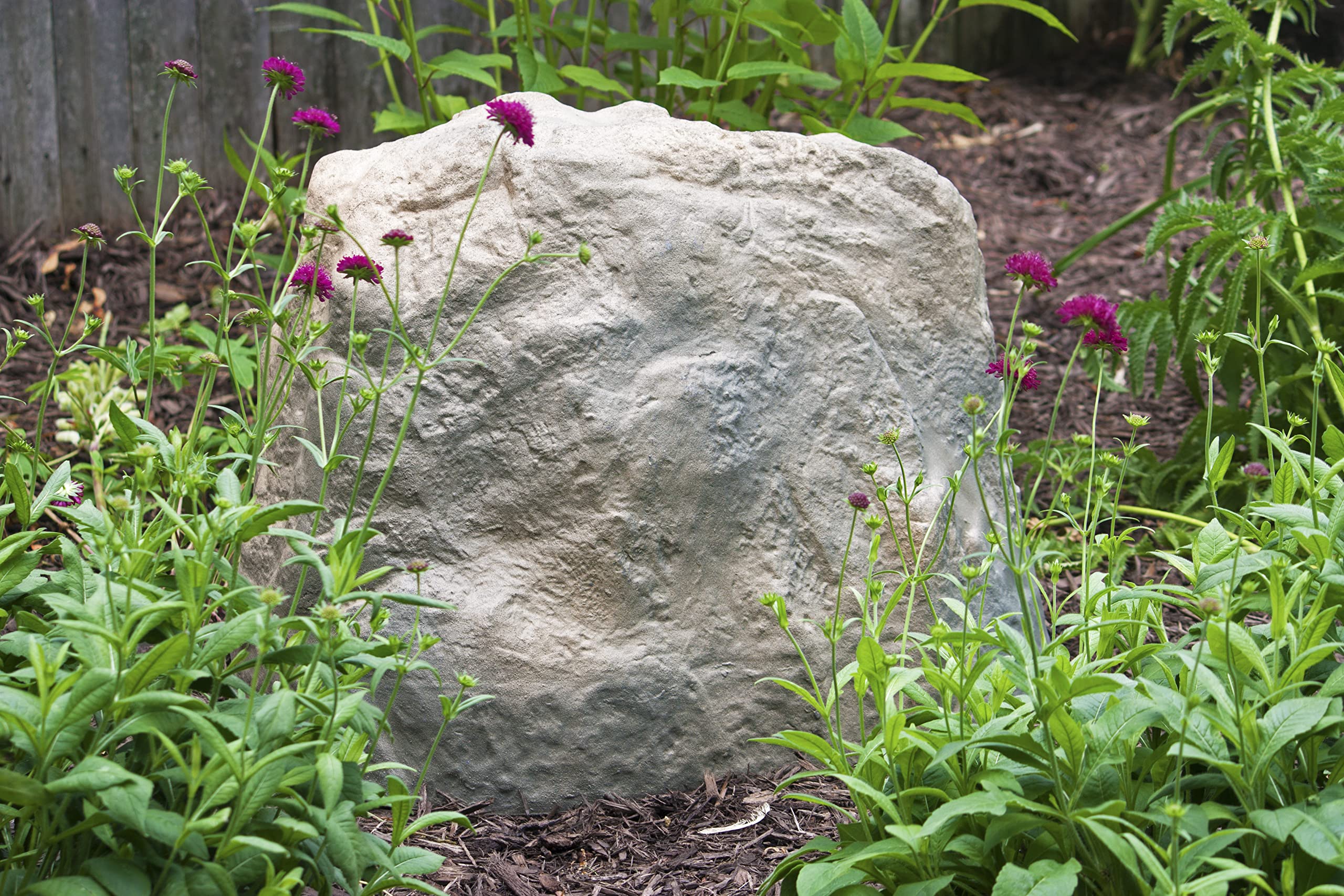 Emsco Group landscape rock covers wells and pipes for a cleaner landscape