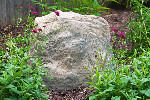 Emsco Group landscape rock covers wells and pipes for a cleaner landscape