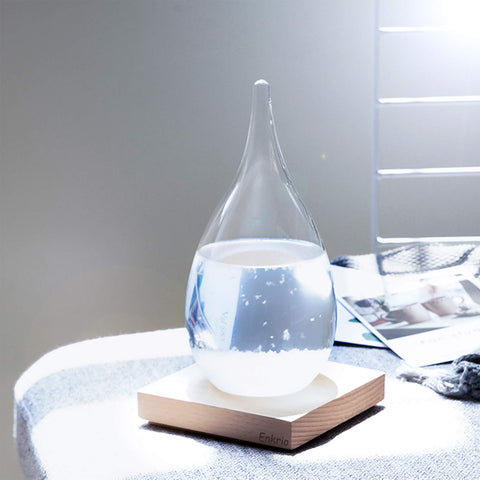 Enkrio storm glass crystal formations create a decorative, atmospheric display.