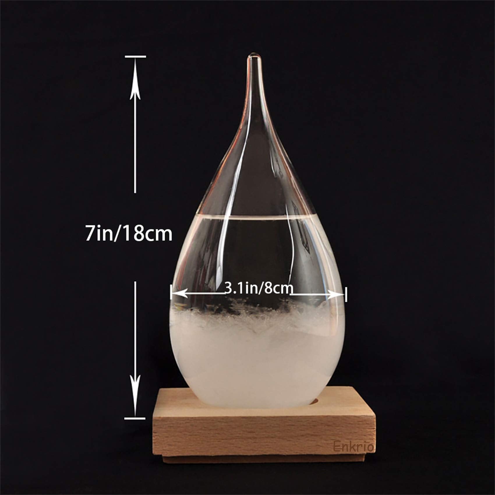 Enkrio storm glass rests on a sturdy wood base for stable placement.