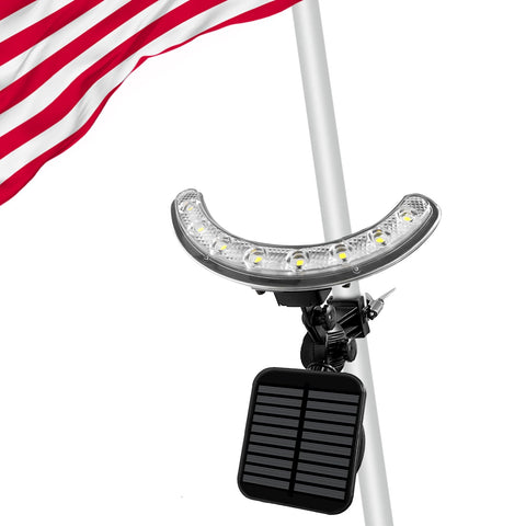 Enrybia flag pole light front view illuminating a flag at dusk