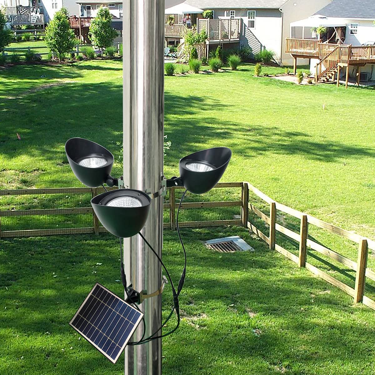 Enrybia solar flag pole light with three spotlights delivering nighttime flag illumination.