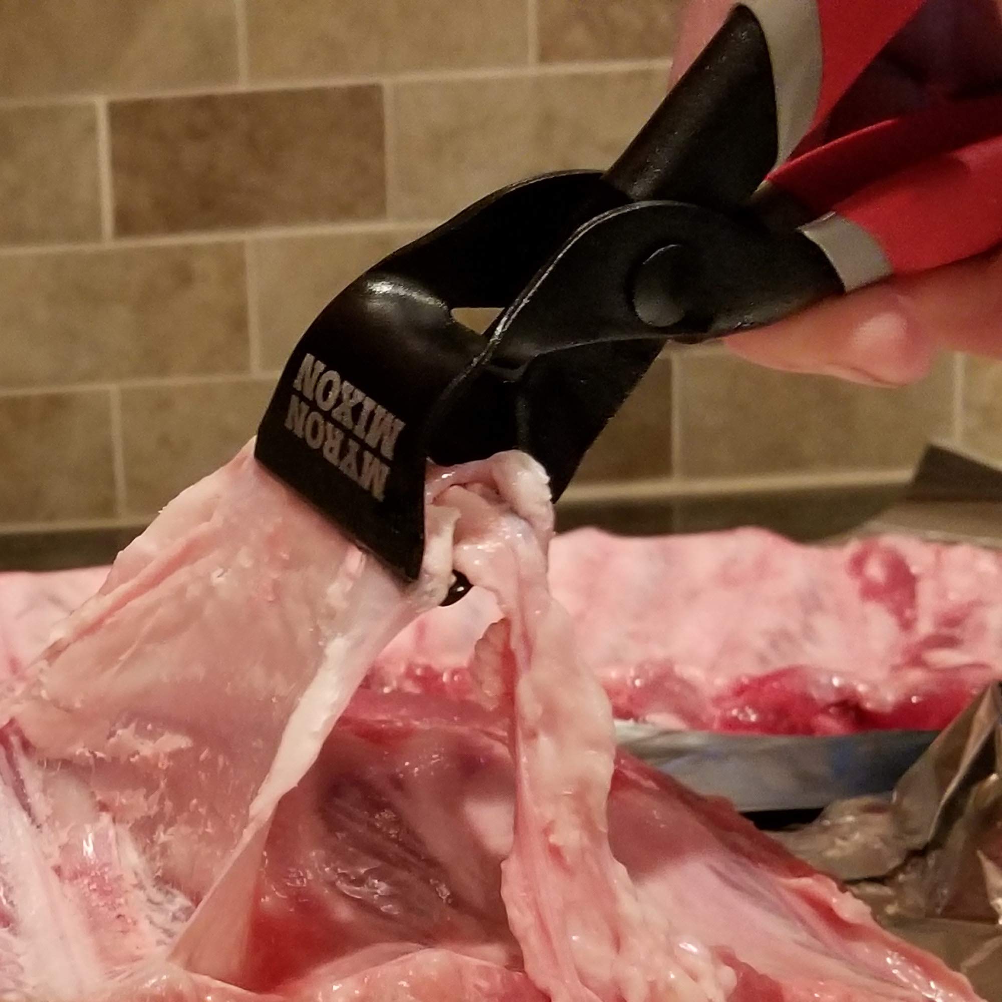 Ergo Chef red non-slip grip improves firm handling on ribs and fish.