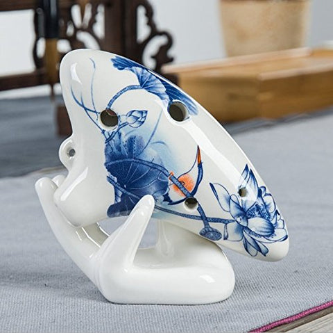 Eshylala white ceramic air plant display container on shelf.
