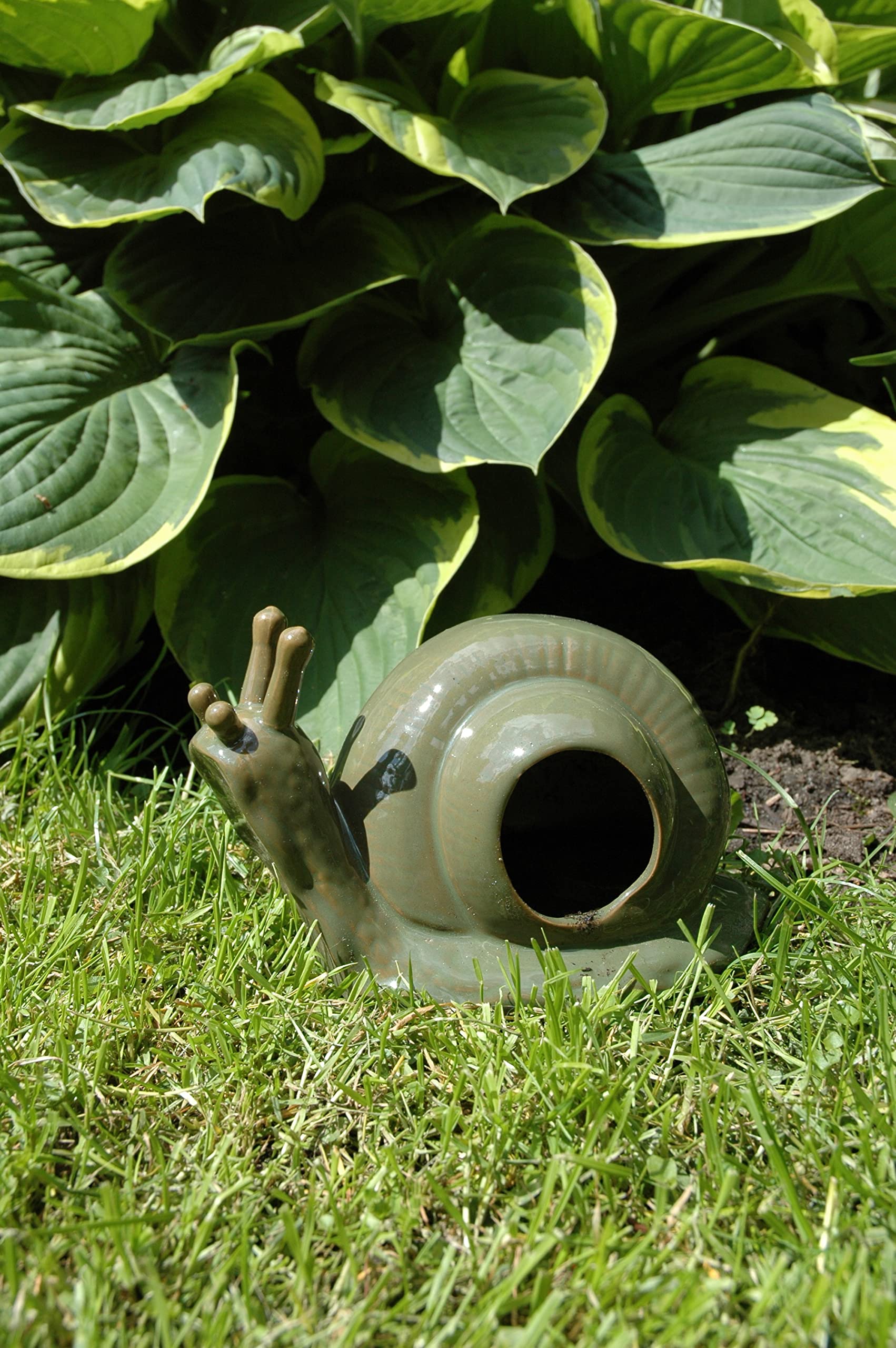 Esschert Design green ceramic slug trap uses beer lure to attract slugs in the garden.
