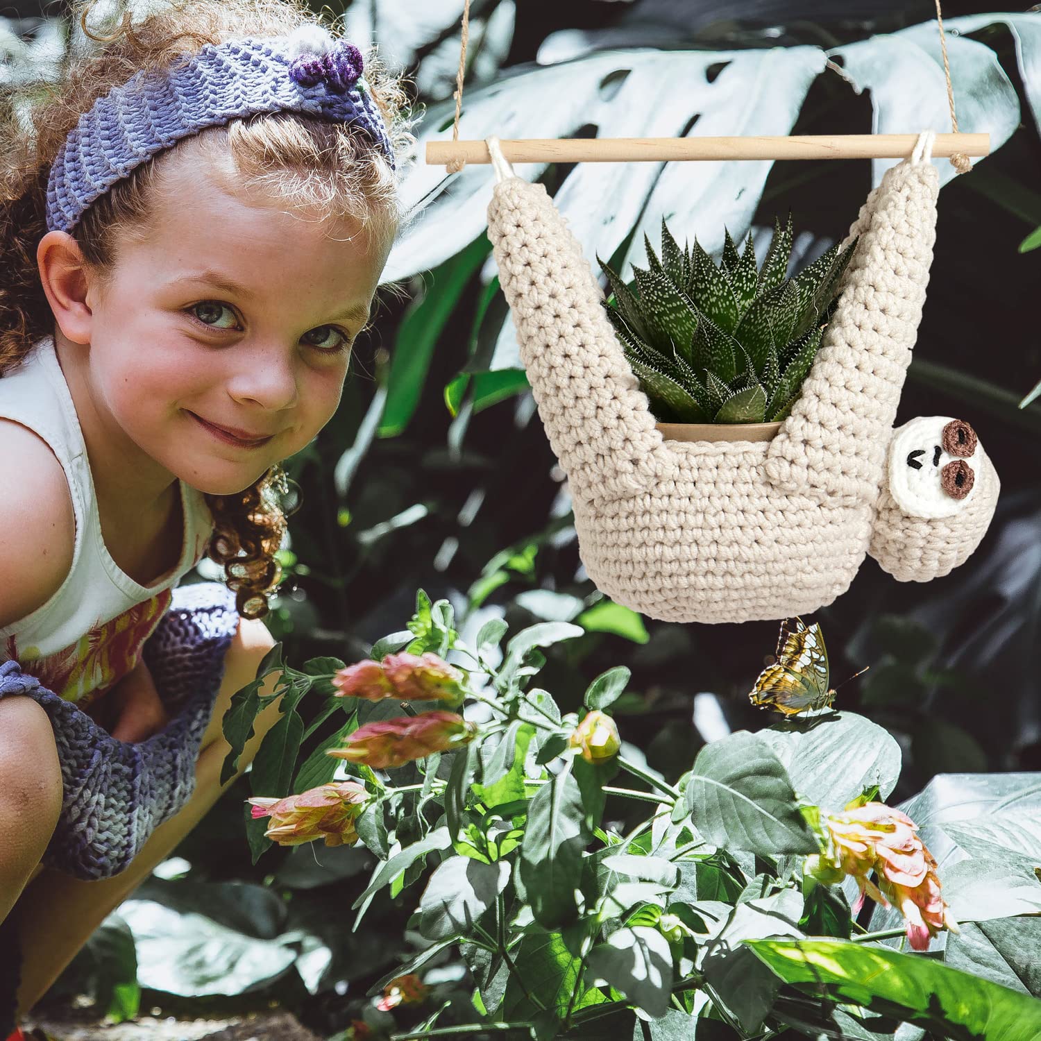 Evbopa sloth planter hangs succulent pots in a cozy corner.
