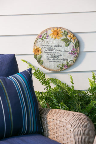Evergreen memorial stone by the front door invites reflection and cherished memories