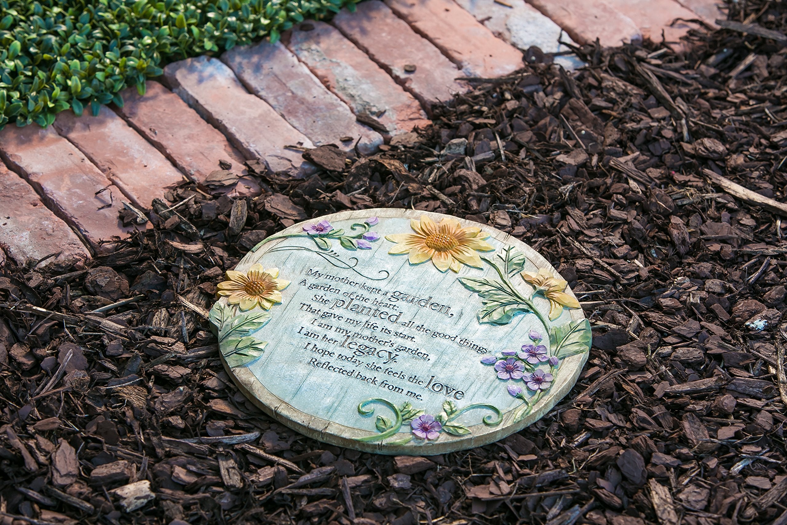 Evergreen flag memorial stone along a garden path enhances curb appeal and memory
