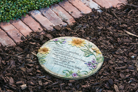 Evergreen flag memorial stone along a garden path enhances curb appeal and memory