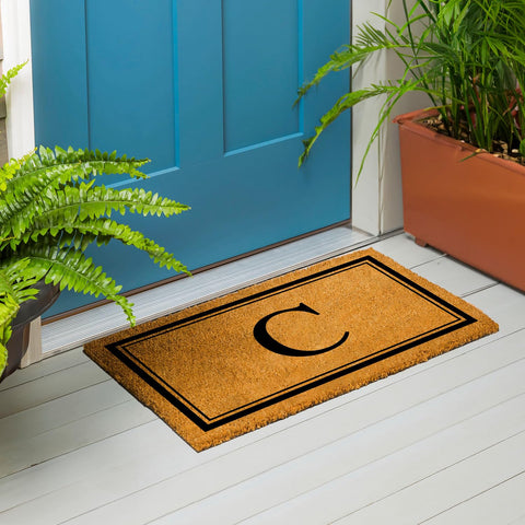 Evergreen Flag monogram C doormat resists fading and staining for durability.