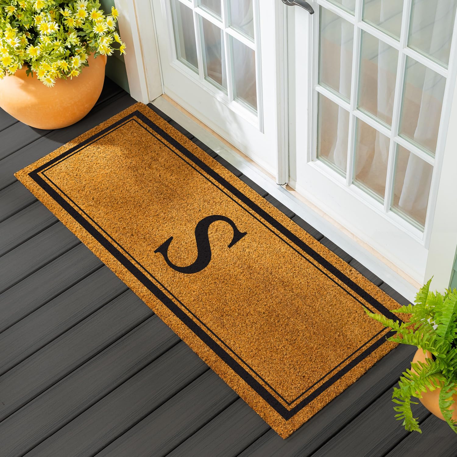 Evergreen Flag monogram coir doormat 60x24 for durable outdoor use.