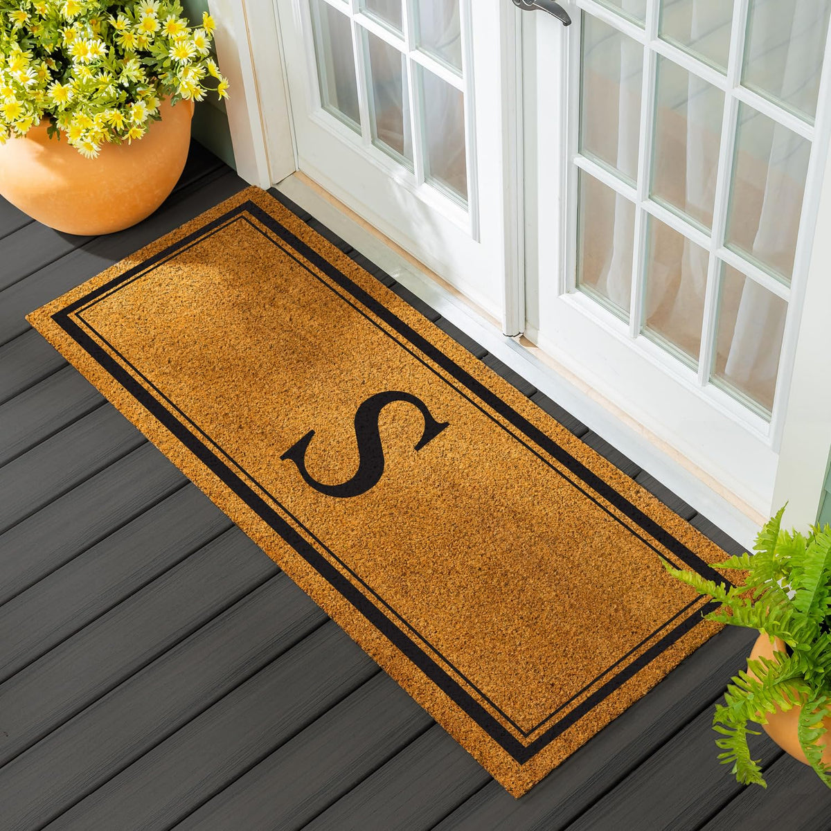Evergreen Flag monogram coir doormat 60x24 for durable outdoor use.