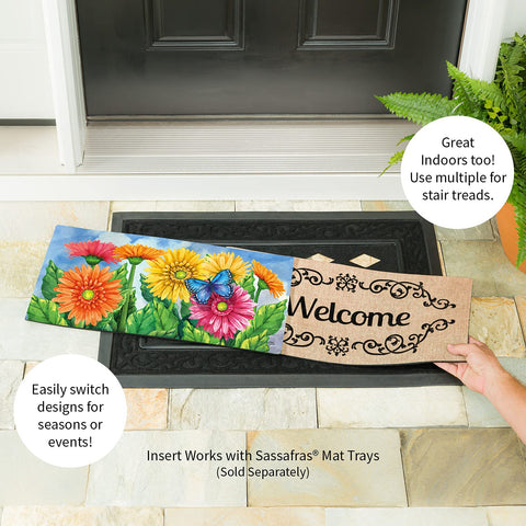 Sassafras Gerbera Daisies doormat with non-slip backing stays secure on porch.