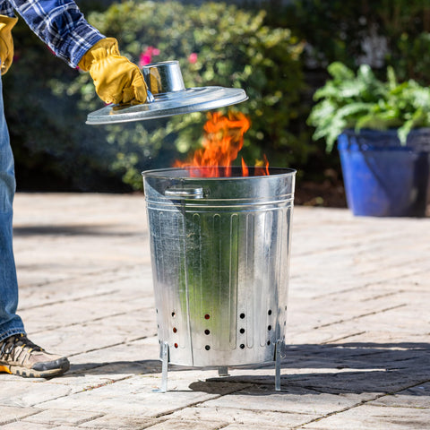 Evergreen Garden incinerator burn barrel with lid, outdoor use for yard waste disposal.