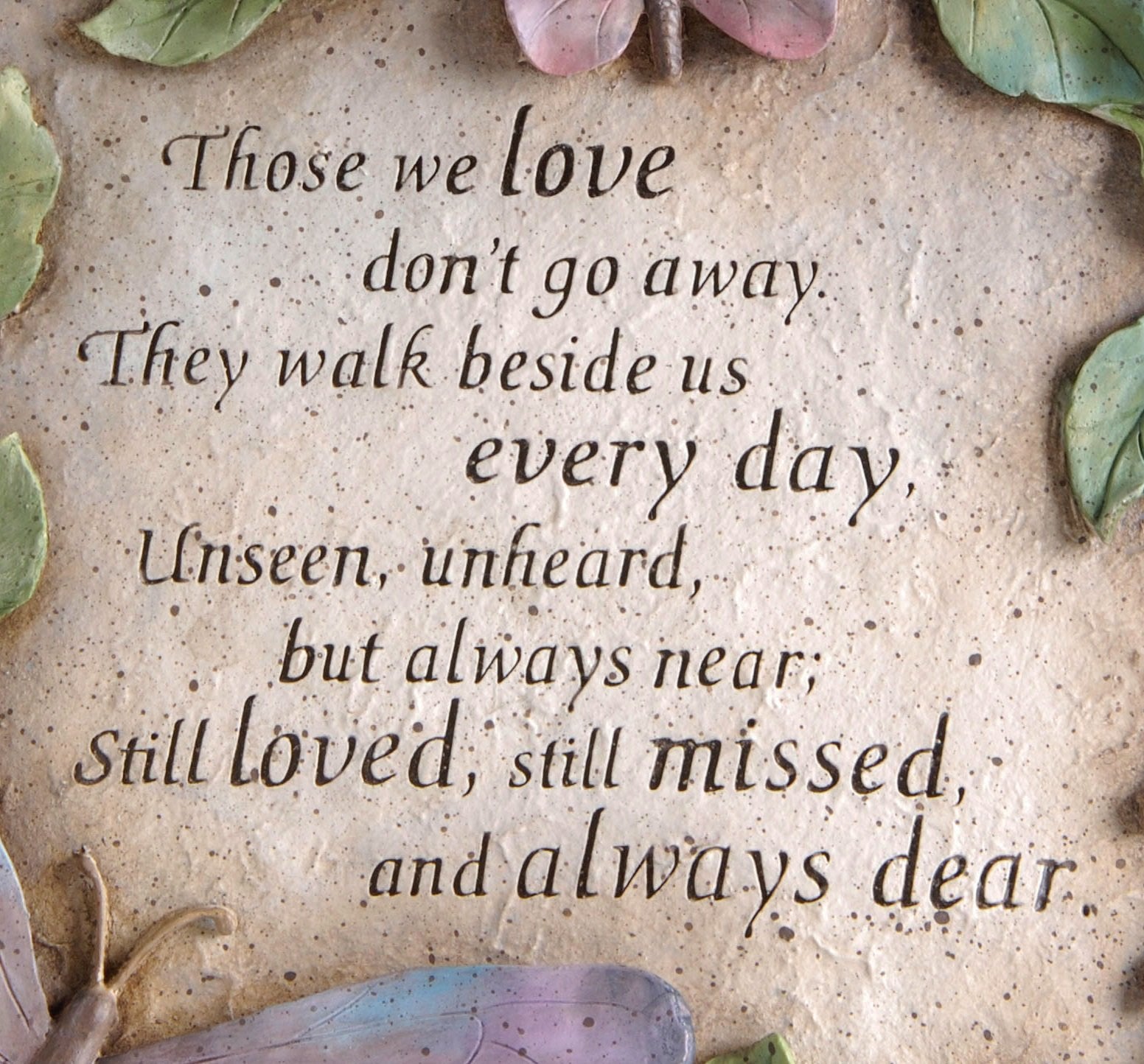 Butterflies and leaves detail on Evergreen Garden memorial stone for outdoor decor.