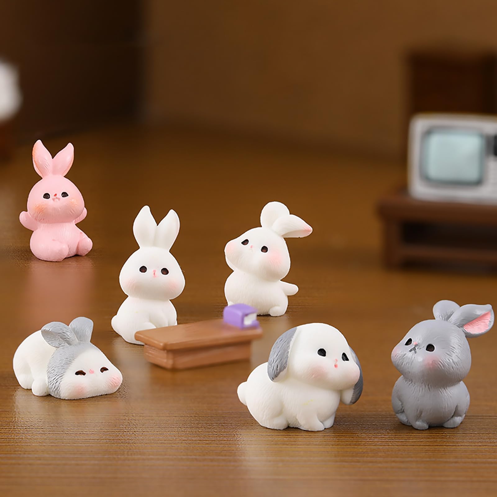 Exasinine shadowbox rabbit figures bring life to framed mini worlds.