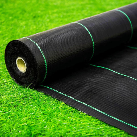 EXTRAEASY weed barrier roll 4ft x 180ft suppressing weeds in a garden bed