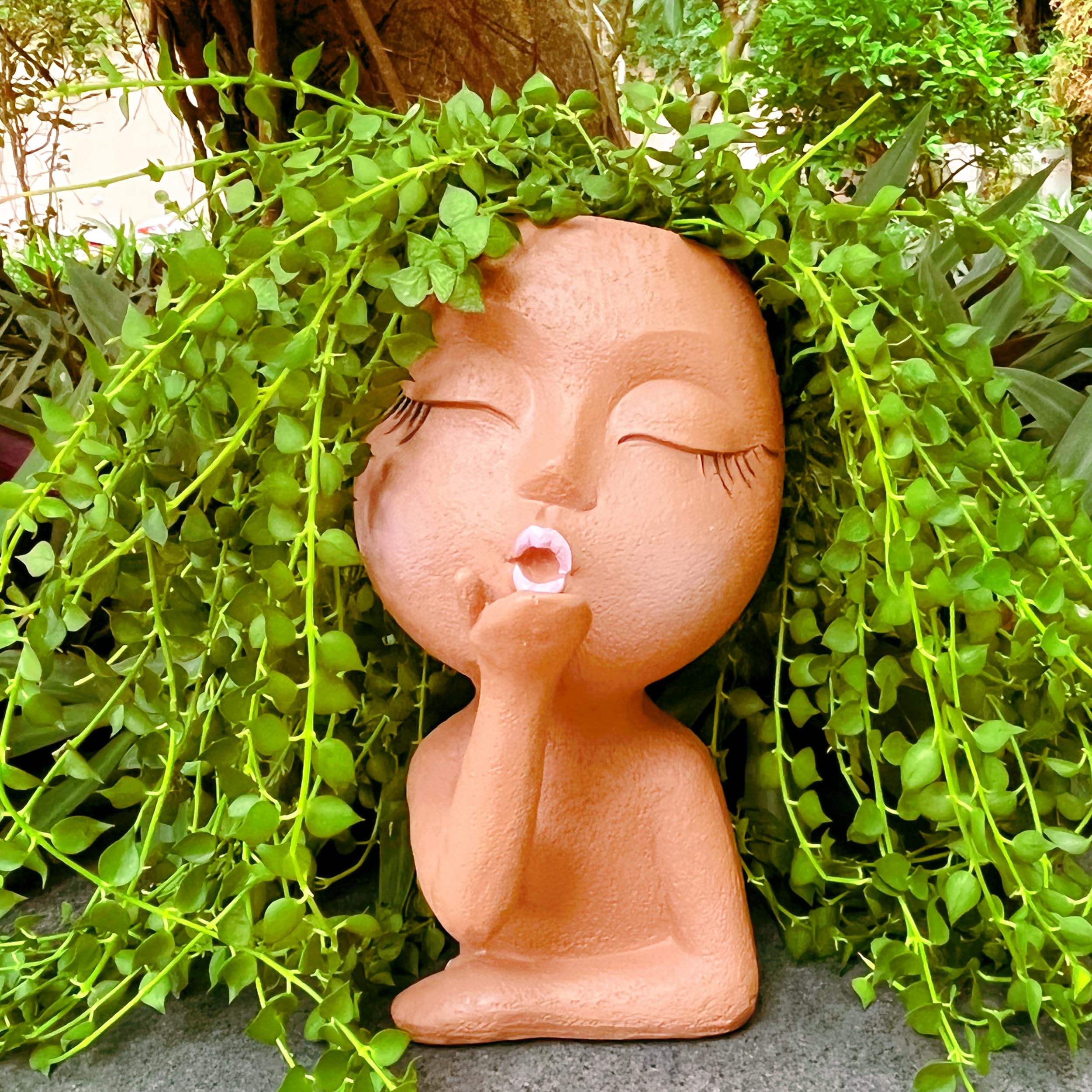 EylbKey brown resin face pot with opening; lightweight and durable decor.