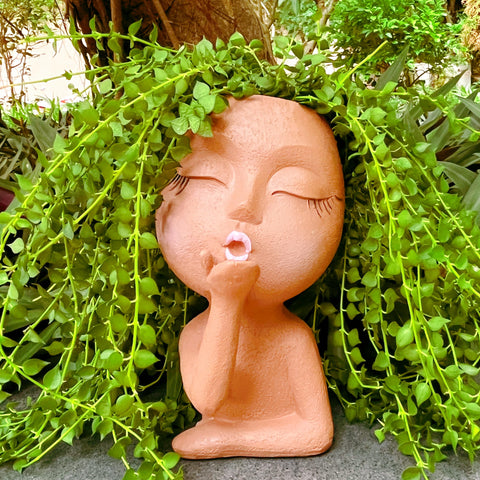 EylbKey brown resin face pot with opening; lightweight and durable decor.