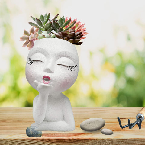 EylbKey indoor-outdoor display with a charming face planter.