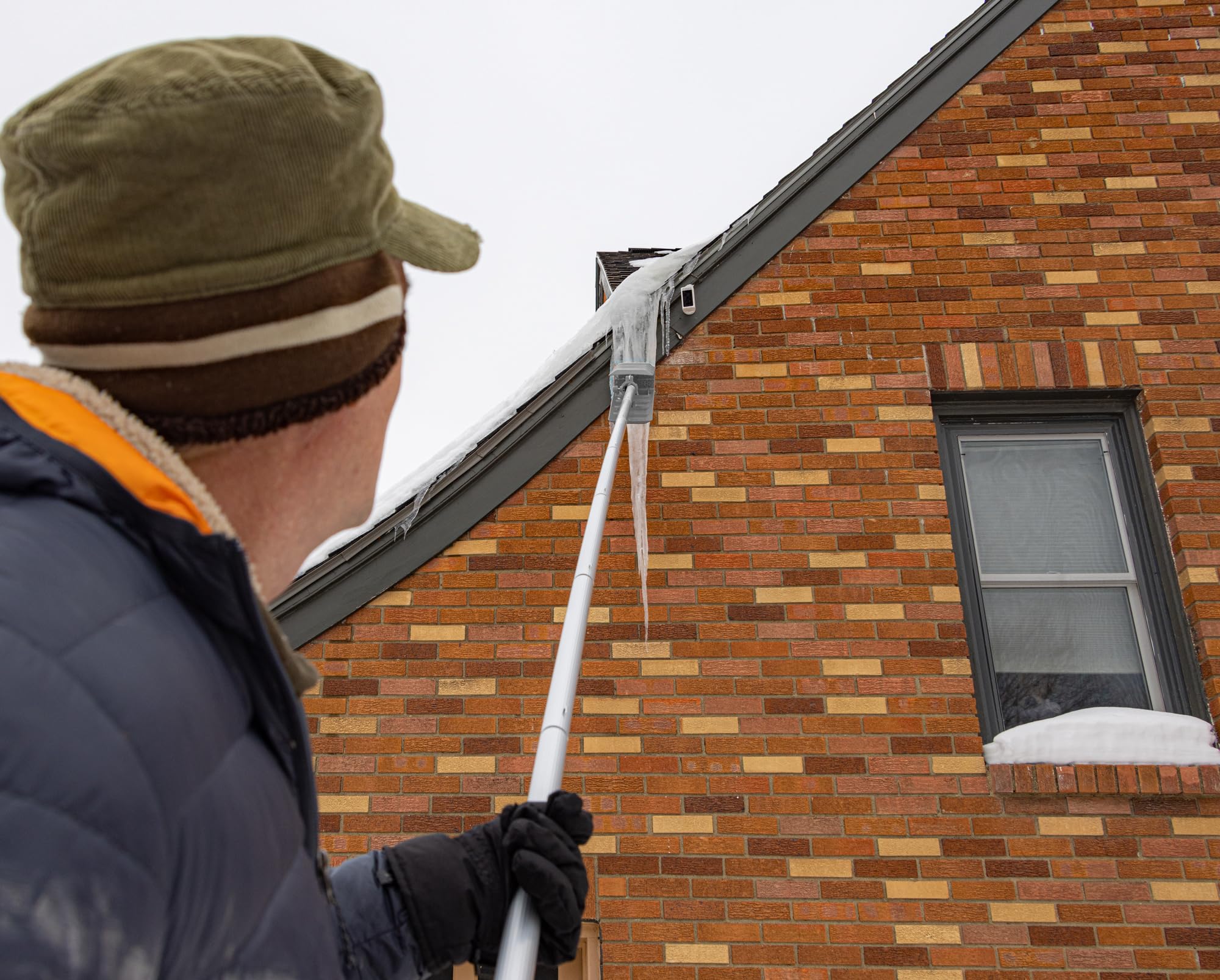 EZ SMART Snow Roof Rake in use on roof clearing snow safely