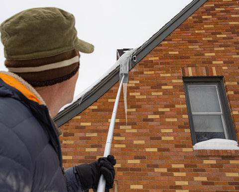 EZ SMART Snow Roof Rake in use on roof clearing snow safely