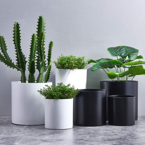 FaithLand 12-inch fiberstone planter matte black finish enhances contemporary décor.