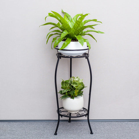 FaithLand two-tier round pot holder keeps plants off the floor, saving space.