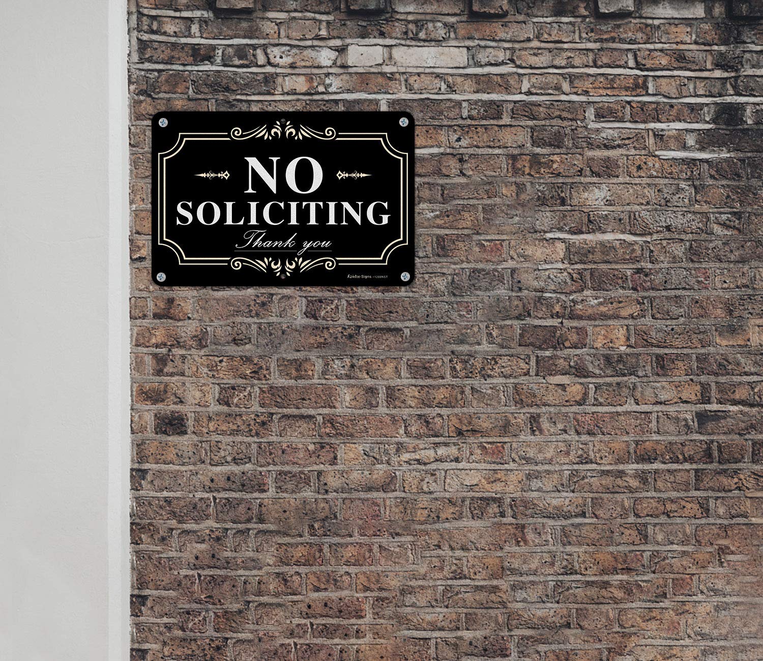 Faittoo No Soliciting Sign visible at night under headlights.